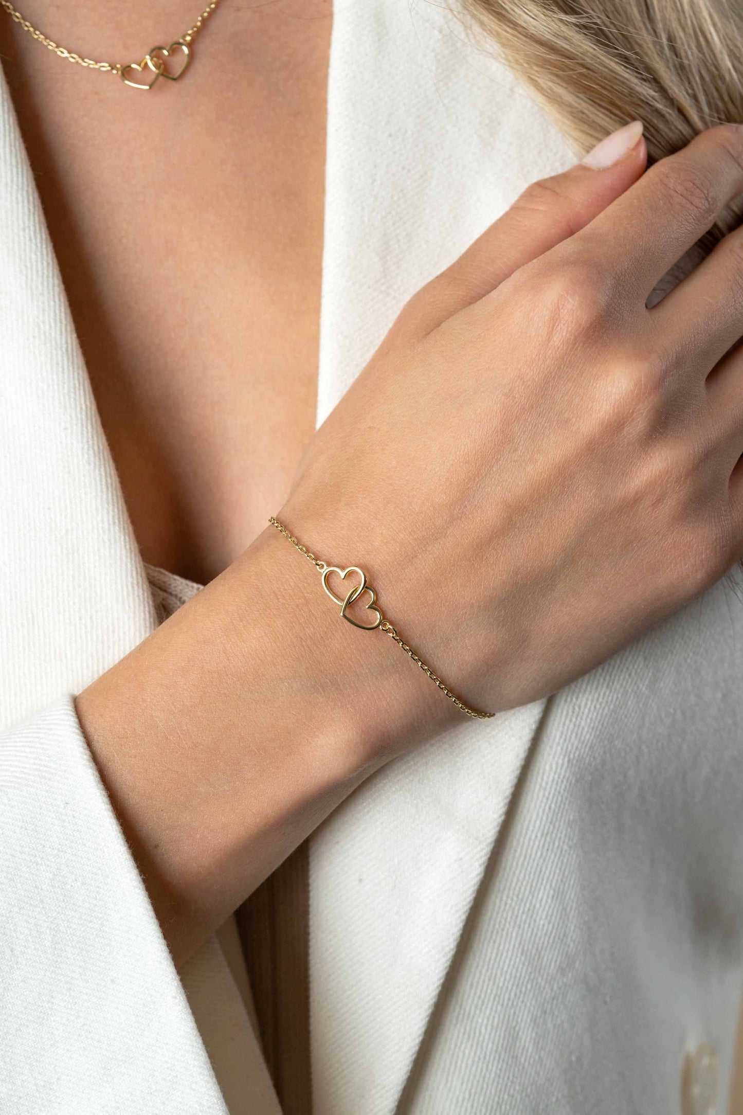 ZINZI ARMBAND GOLD PLATED TWEE HARTJES